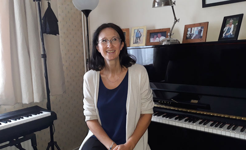 Suzanne in her music room